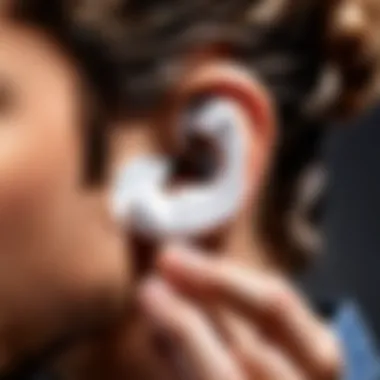 User installing ear hooks on Galaxy Buds