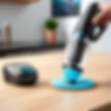 Close-up of Eufy by Anker handheld vacuum demonstrating suction power on various surfaces