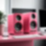 Stylish pink speaker setup on a modern desk