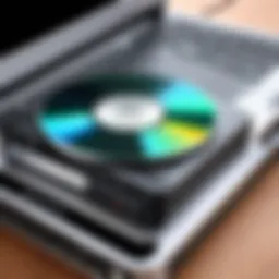 Portable CD/DVD player connected to a laptop.