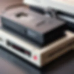 A close-up view of a VHS USB adapter connected to a vintage VHS player.